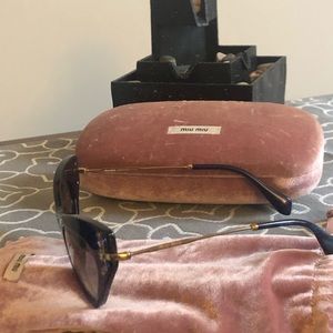 Worn with case and protection pouch Miu Miu shades